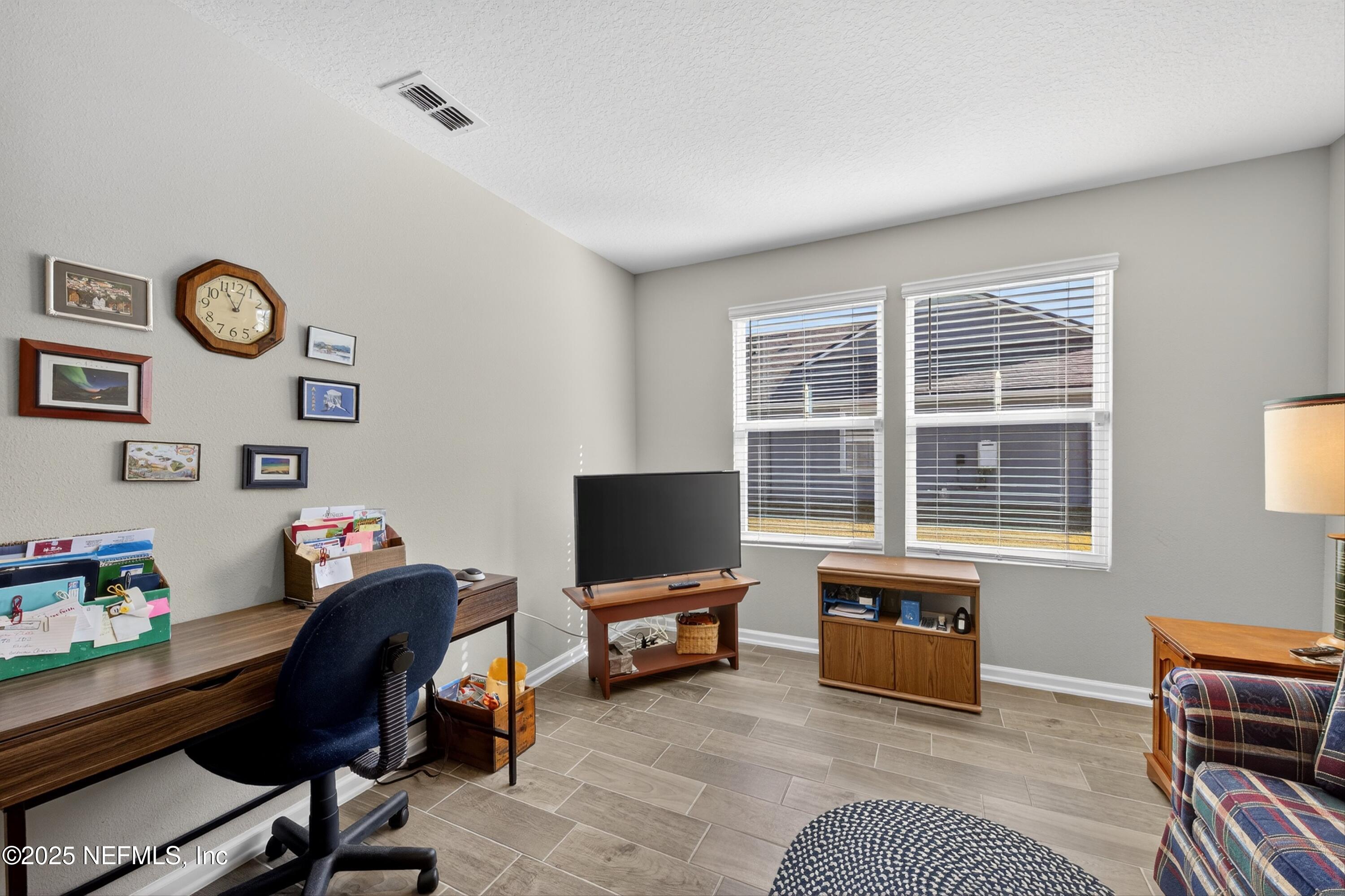70 Spoonbill Circle St. Augustine, FL 32095 - Photo 28 of 76 a view of a workspace with furniture and a window
