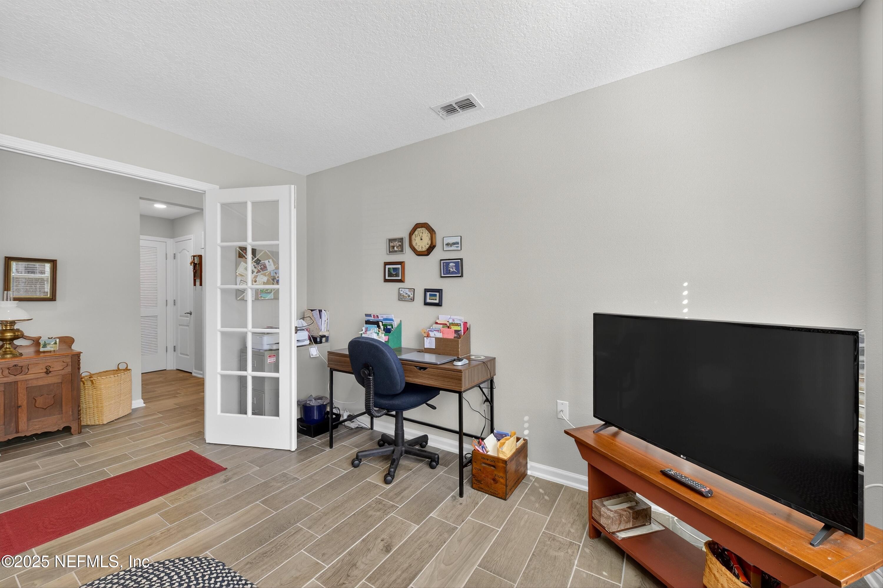 70 Spoonbill Circle St. Augustine, FL 32095 - Photo 29 of 76 a living room with furniture and a flat screen tv