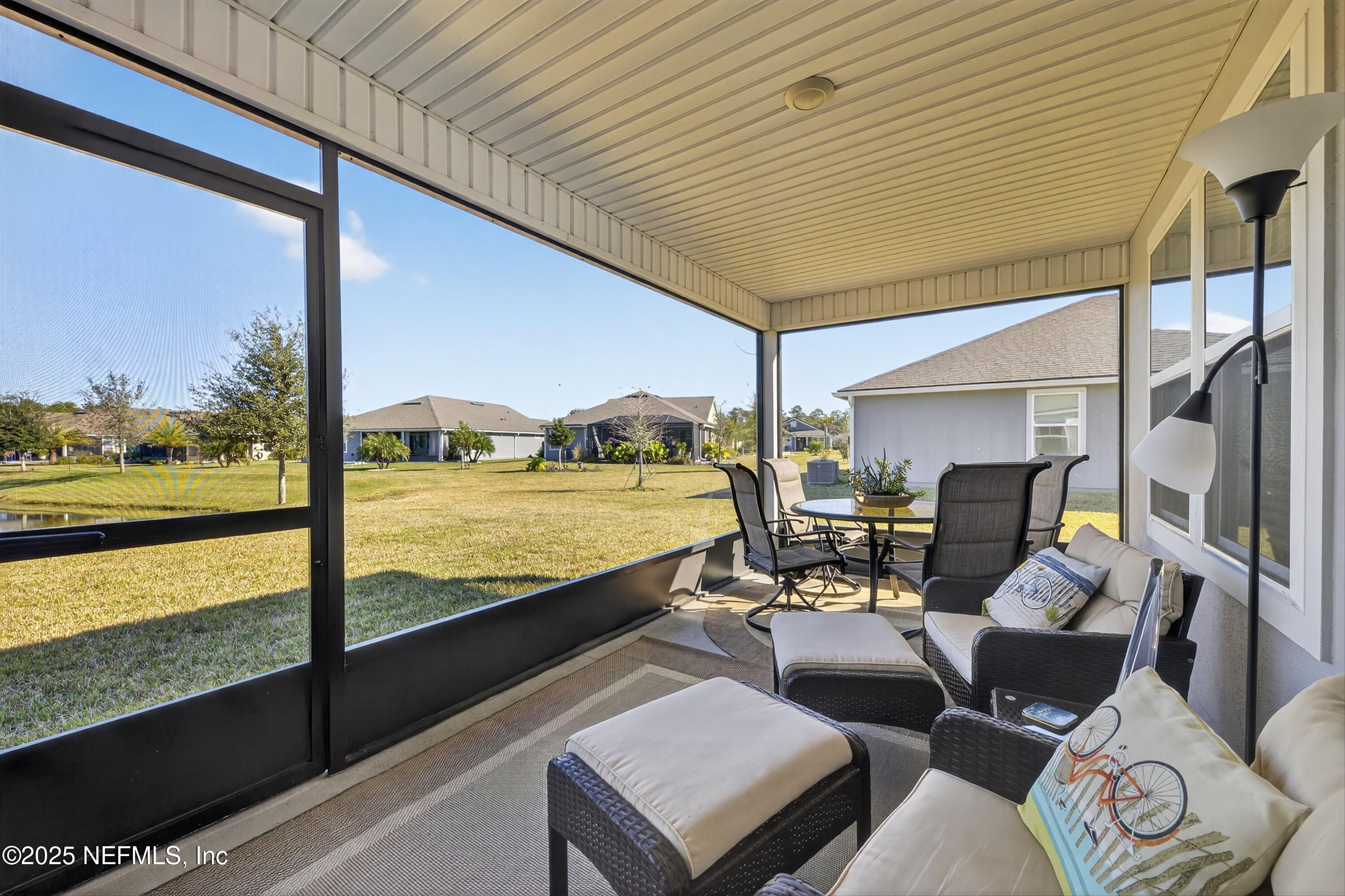 70 Spoonbill Circle St. Augustine, FL 32095 - Photo 32 of 76 a living room with large windows