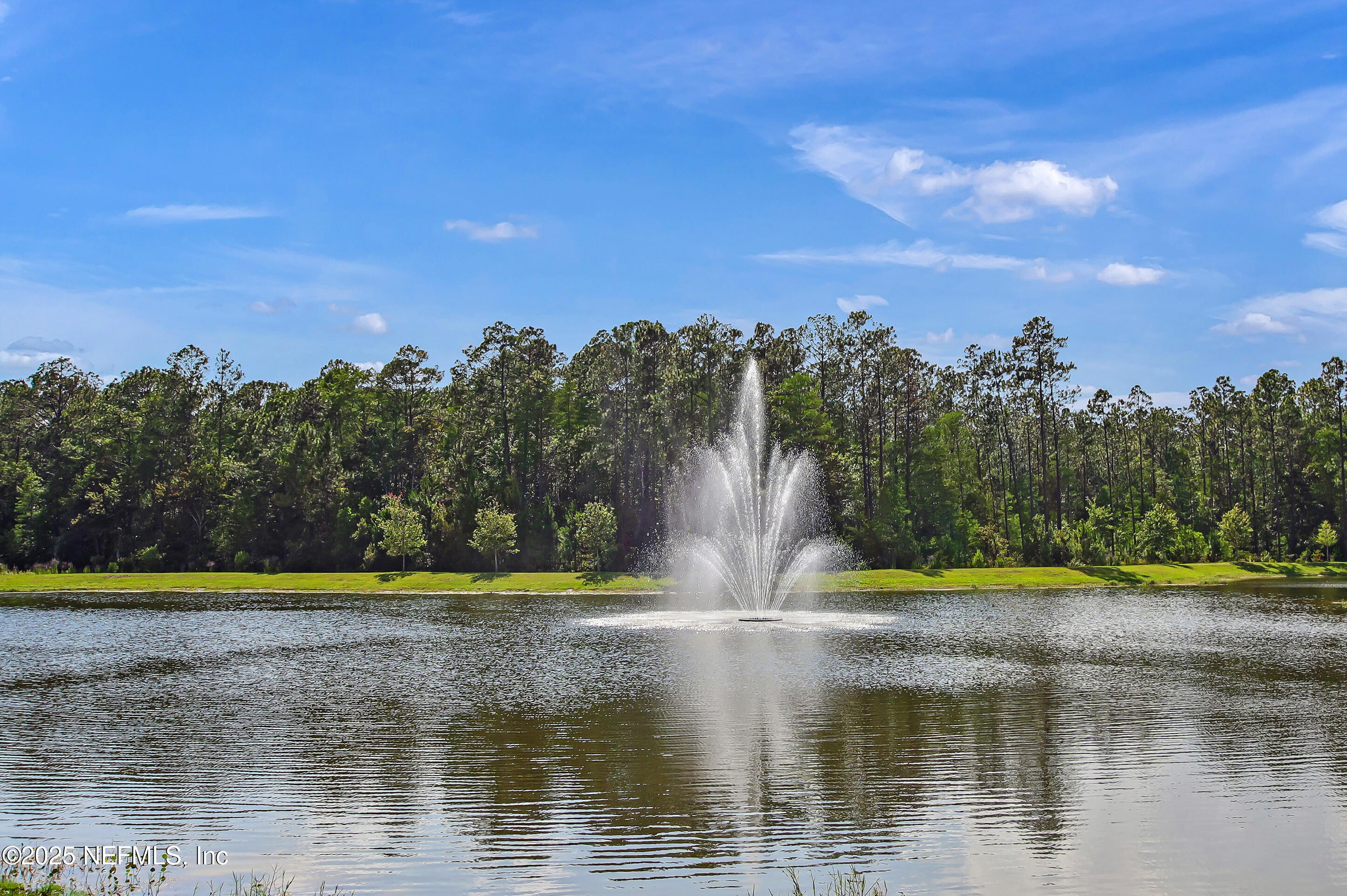 70 Spoonbill Circle St. Augustine, FL 32095 - Photo 43 of 76 a view of a lake with a yard