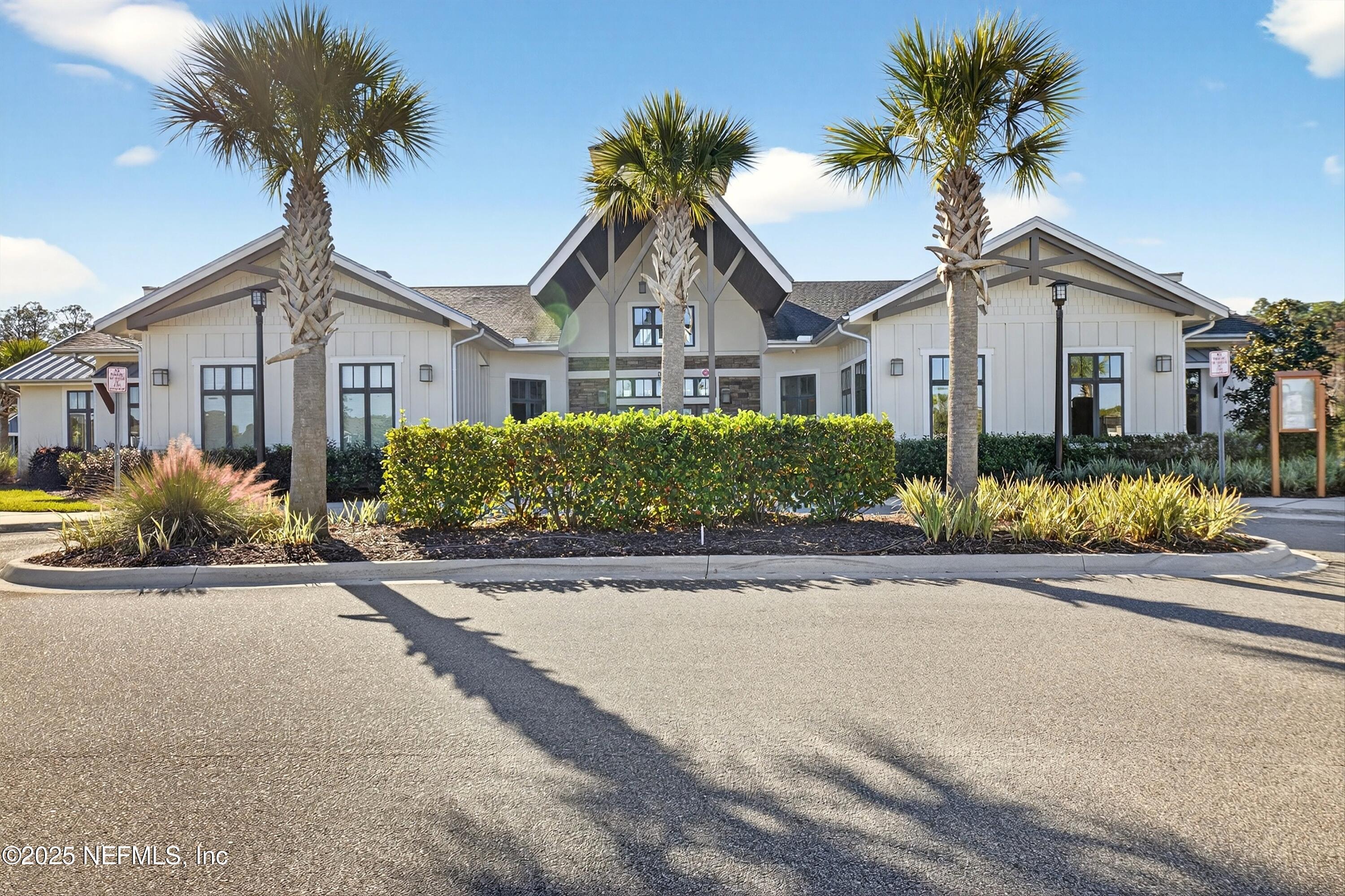70 Spoonbill Circle St. Augustine, FL 32095 - Photo 45 of 76 a front view of a house with a garden and a garage