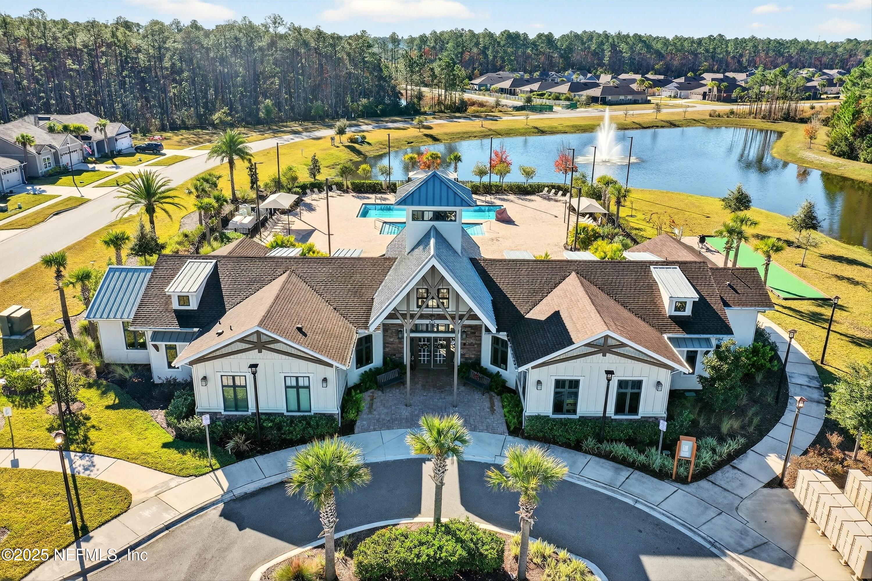 70 Spoonbill Circle St. Augustine, FL 32095 - Photo 49 of 76 an aerial view of a house with a swimming pool patio and lake view