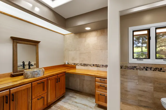 a bathroom with a sink and a large mirror