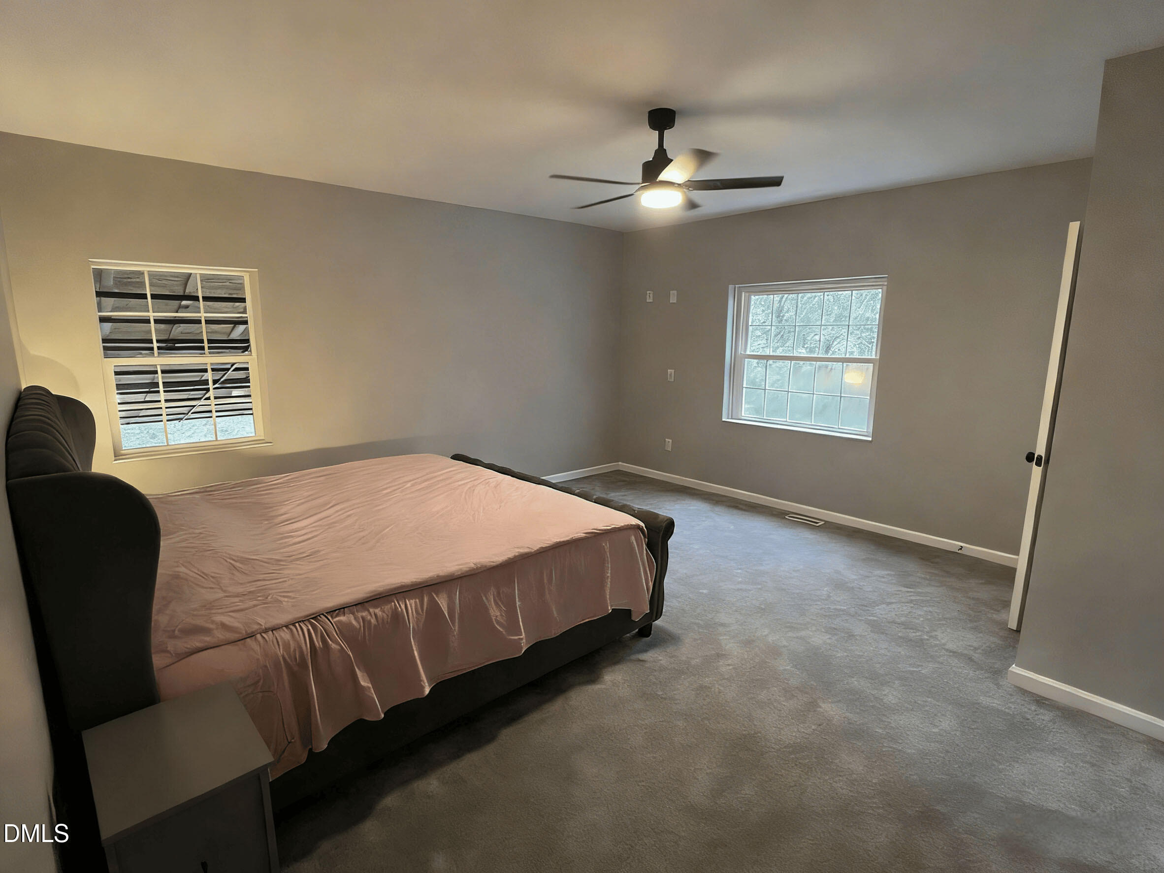 409 Rockingham Street Carthage, NC 28327 - Photo 35 of 56 a bed sitting in a bedroom next to a window