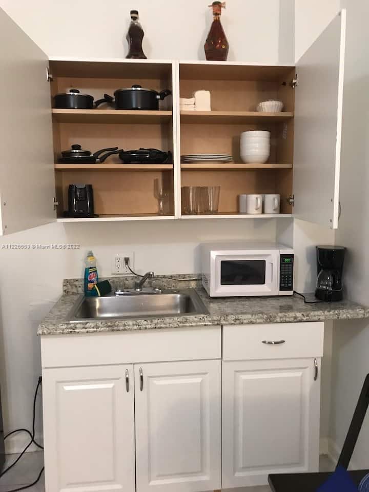 a kitchen with a stove and cabinets