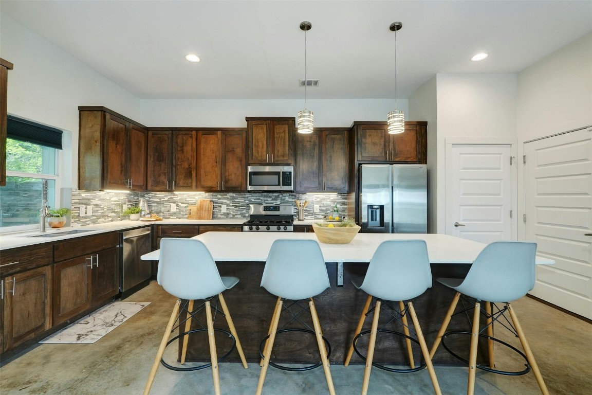 This kitchen will make your heart skip a beat with joy.  The Large island comfortably seats 4 adults while still having plenty of space for meal prep and entertaining.  Smooth quartz counter tops and stainless appliances give an updated, sleek look.