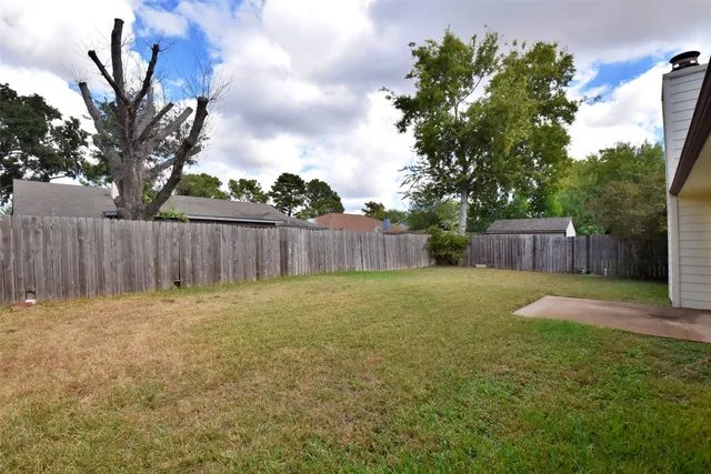 a backyard of a house with lots of green space