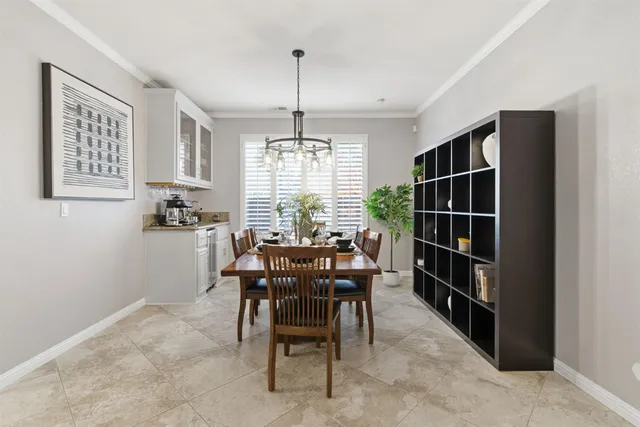 a kitchen with stainless steel appliances granite countertop a stove and a white cabinets