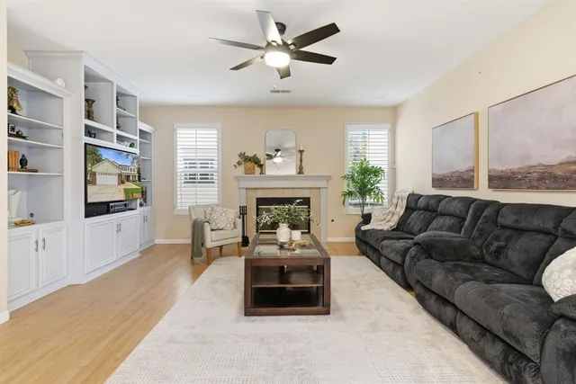 a bedroom with a bed and a potted plant
