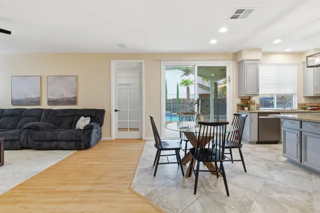 a bedroom with a bed and a potted plant