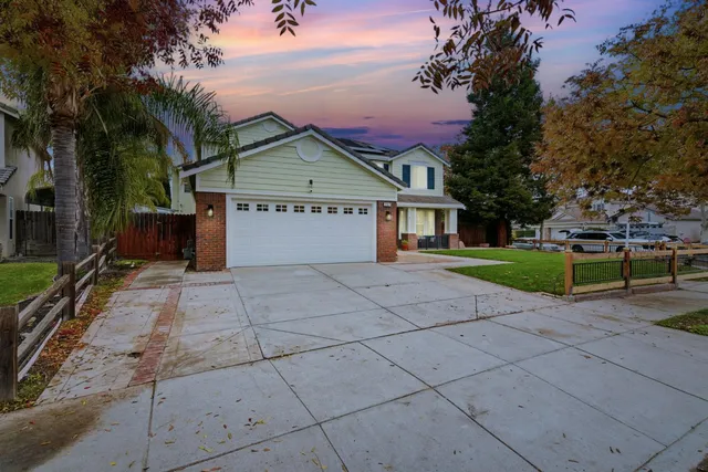 front view of a house with a bench