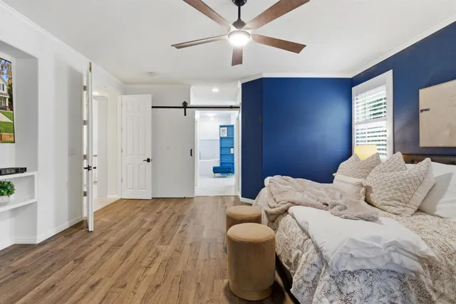 an aerial view of a house with a yard and garden