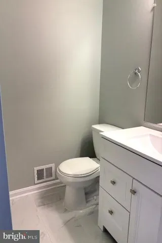a bathroom with a toilet and a sink