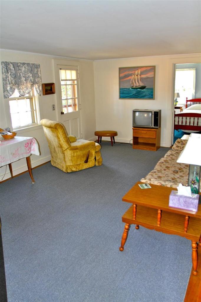 575 Great Pond Road Eastham, MA 02642 - Photo 13 of 23 a living room with furniture pool table and windows
