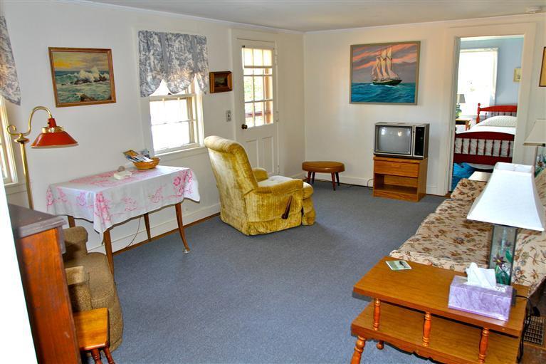 575 Great Pond Road Eastham, MA 02642 - Photo 14 of 23 a bedroom with furniture and a wooden floor