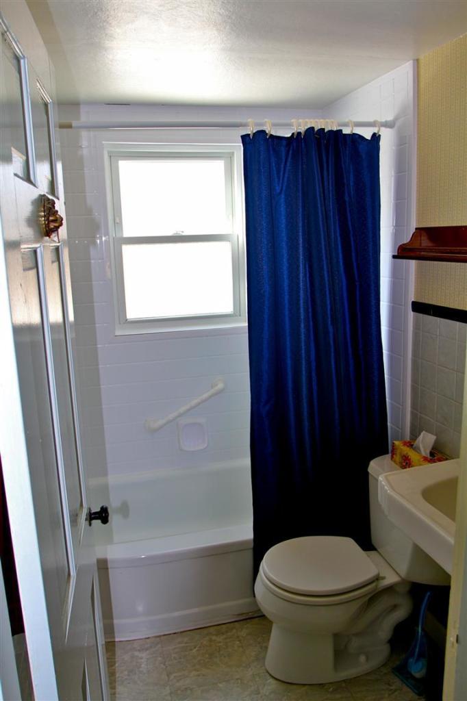 575 Great Pond Road Eastham, MA 02642 - Photo 18 of 23 a bathroom with a toilet a sink and a bathtub