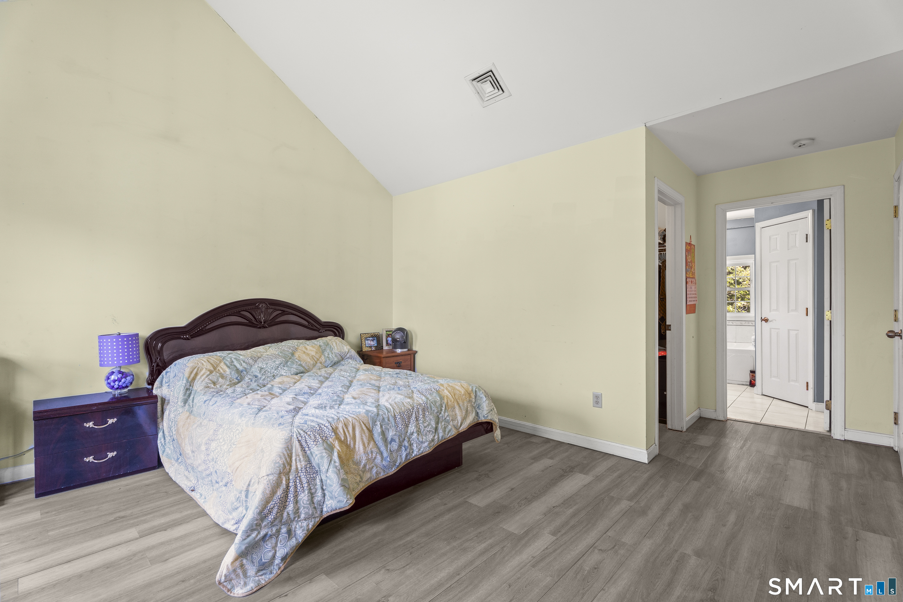 52 Middle Road Preston, CT 06365 - Photo 21 of 39 a bedroom with a bed and wooden floor
