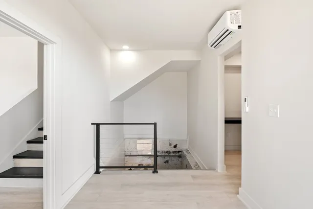 a view of a hallway with staircase