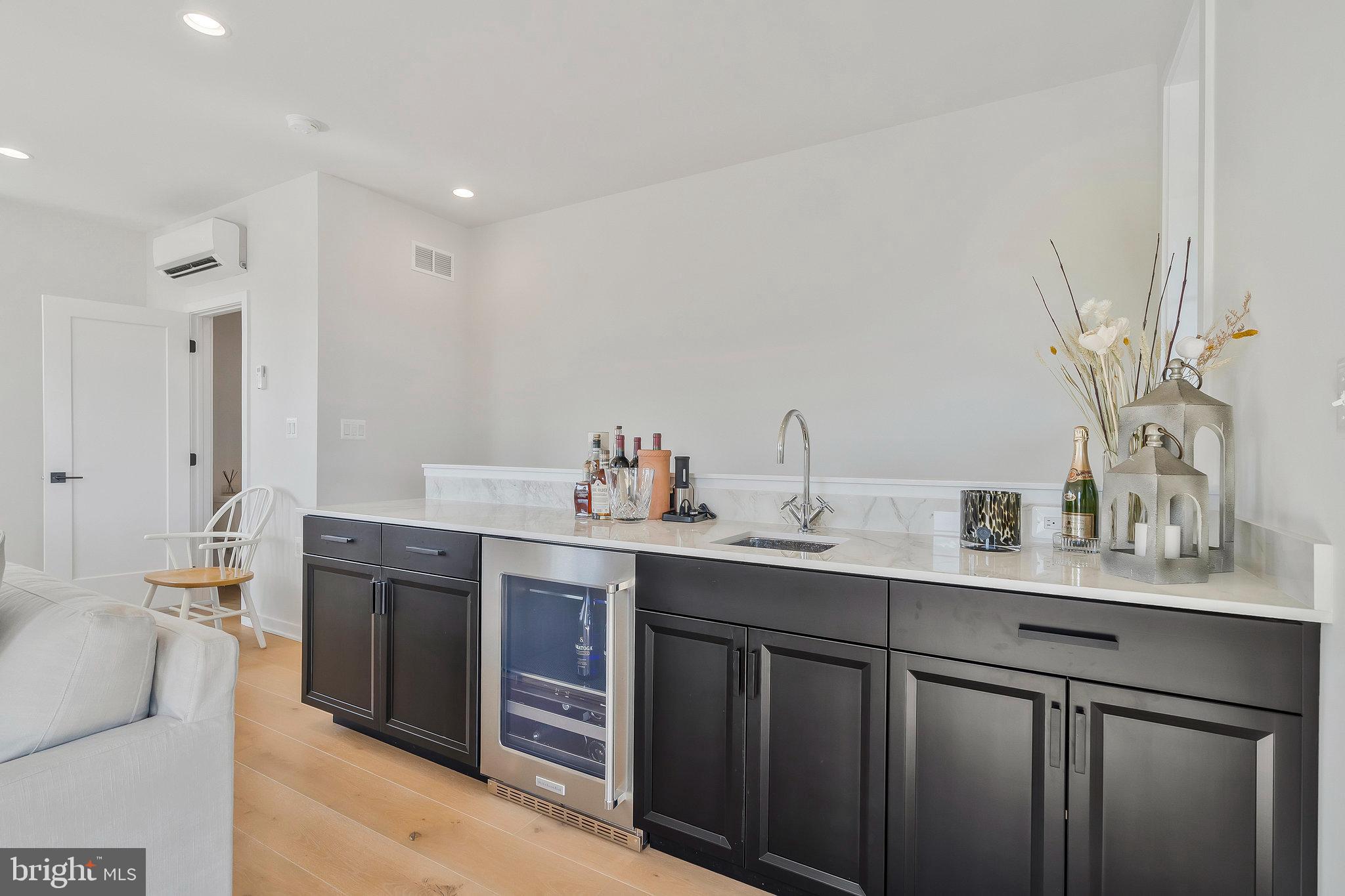 1968 Roland Clarke Place Reston, VA 20191 - Photo 32 of 36 Wet bar with wine refrigerator