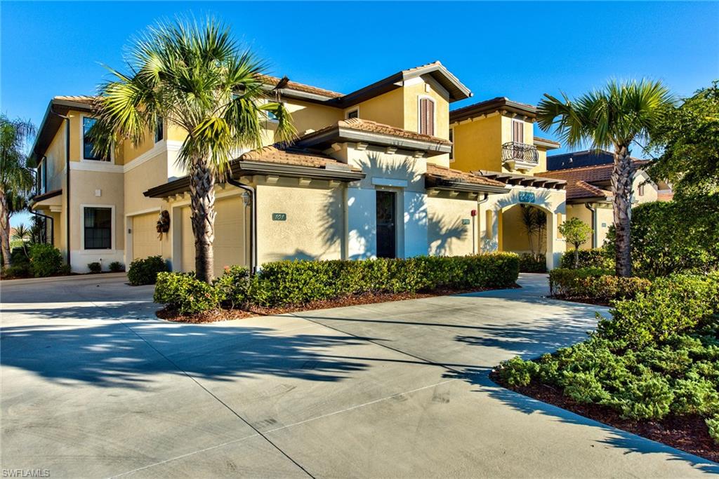 10470 Casella Way, Unit 101 Fort Myers, FL 33913 - Photo 1 of 34 a front view of a house with a yard