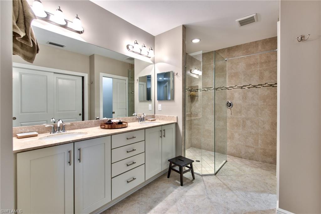 10470 Casella Way, Unit 101 Fort Myers, FL 33913 - Photo 15 of 34 a bathroom with a shower sink and mirror
