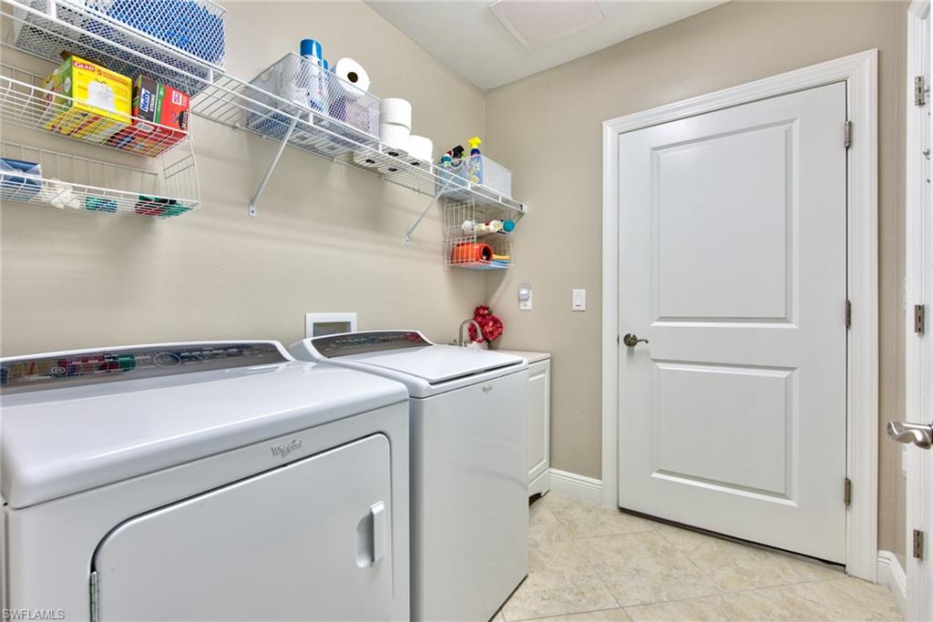 10470 Casella Way, Unit 101 Fort Myers, FL 33913 - Photo 19 of 34 a utility room with dryer and washer