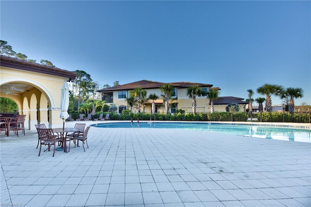 10470 Casella Way, Unit 101 Fort Myers, FL 33913 - Photo 22 of 34 a view of house with outdoor seating and city view