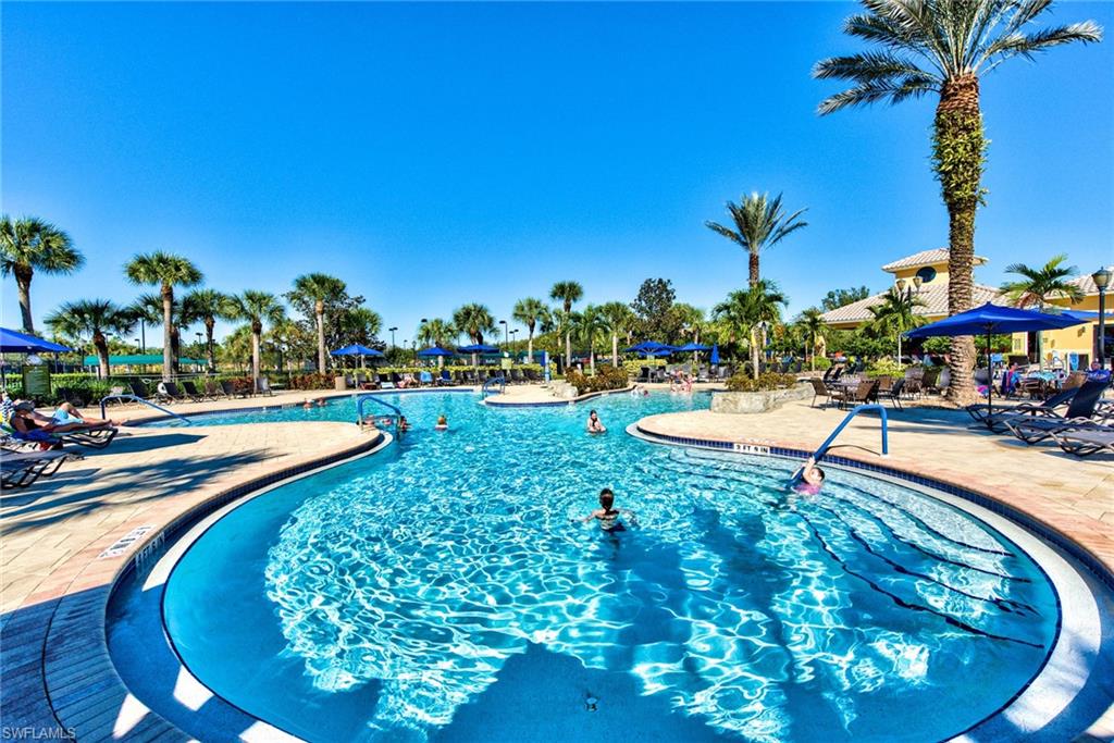 10470 Casella Way, Unit 101 Fort Myers, FL 33913 - Photo 31 of 34 a view of a swimming pool with a yard and sitting area