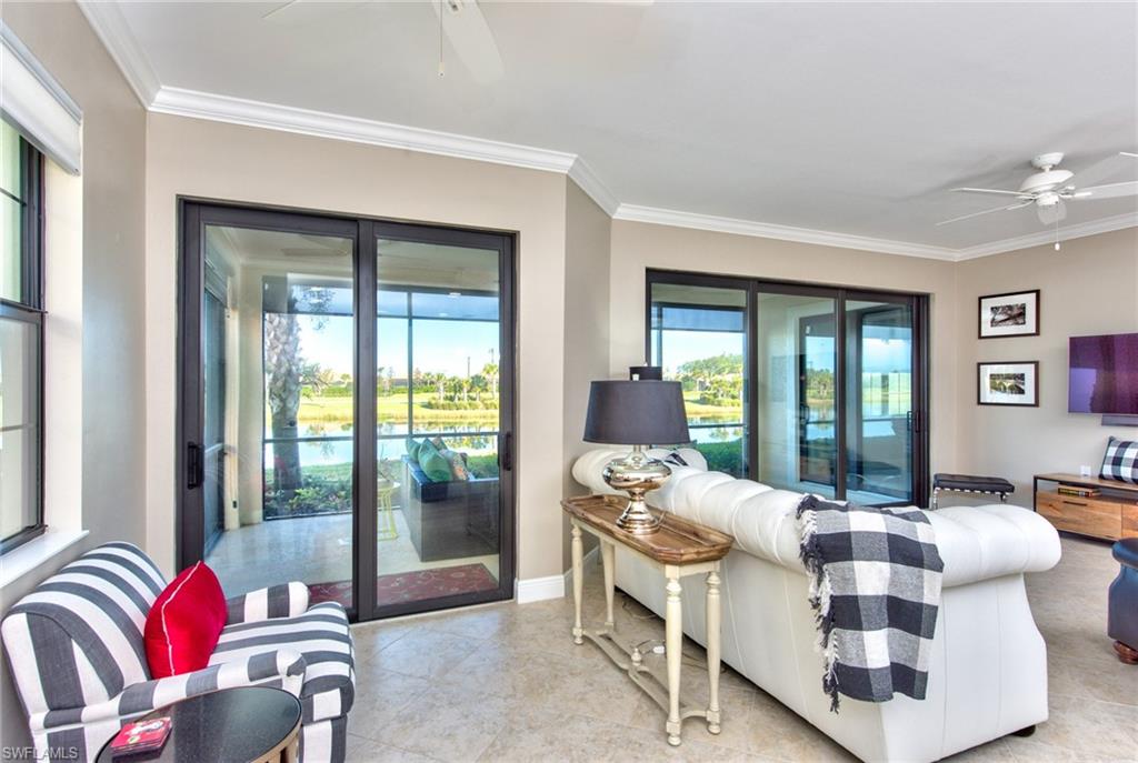 10470 Casella Way, Unit 101 Fort Myers, FL 33913 - Photo 10 of 34 a living room with furniture and a large window