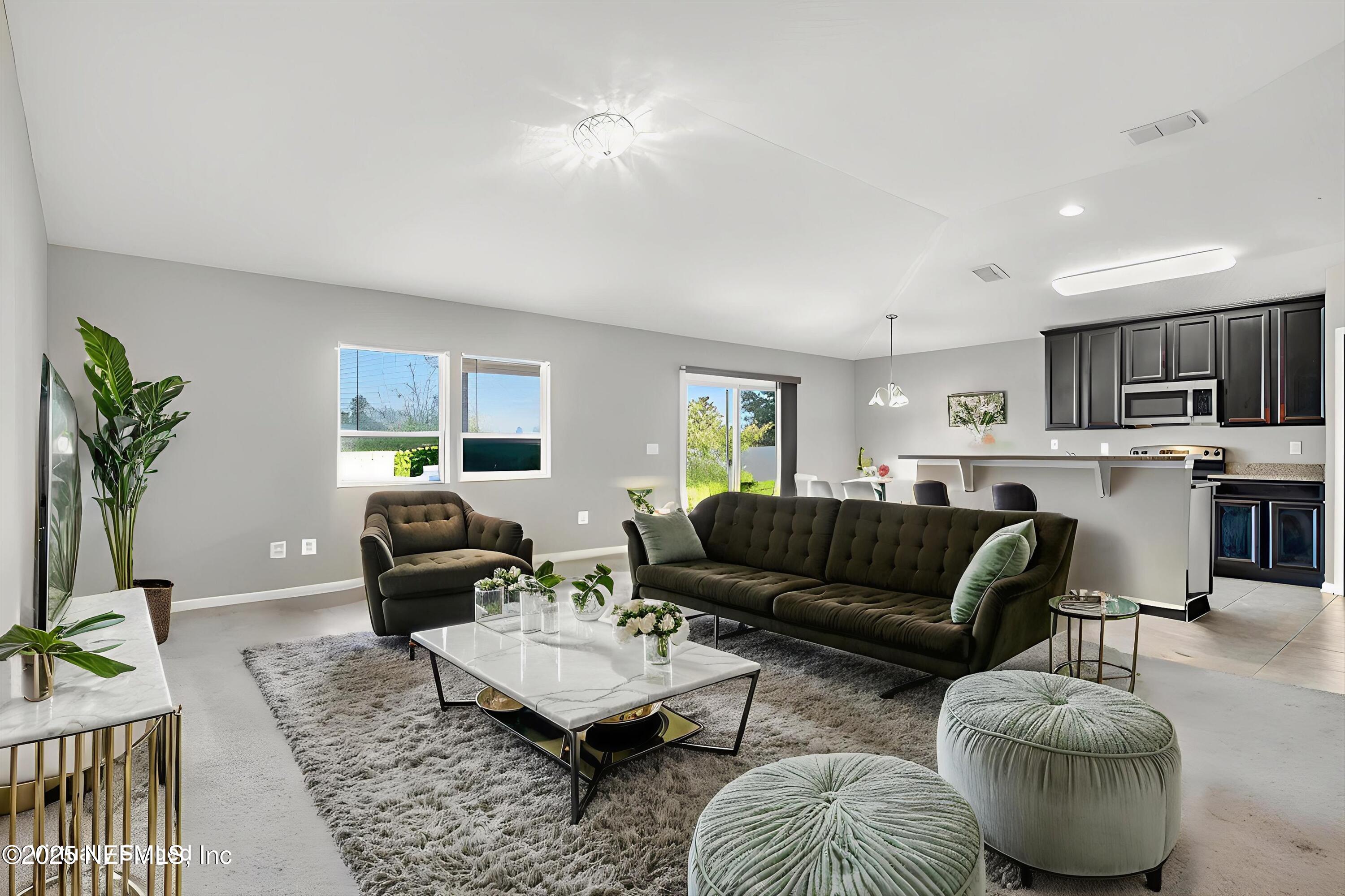 4045 Trail Ridge Road Middleburg, FL 32068 - Photo 11 of 45 a living room with furniture and a couch