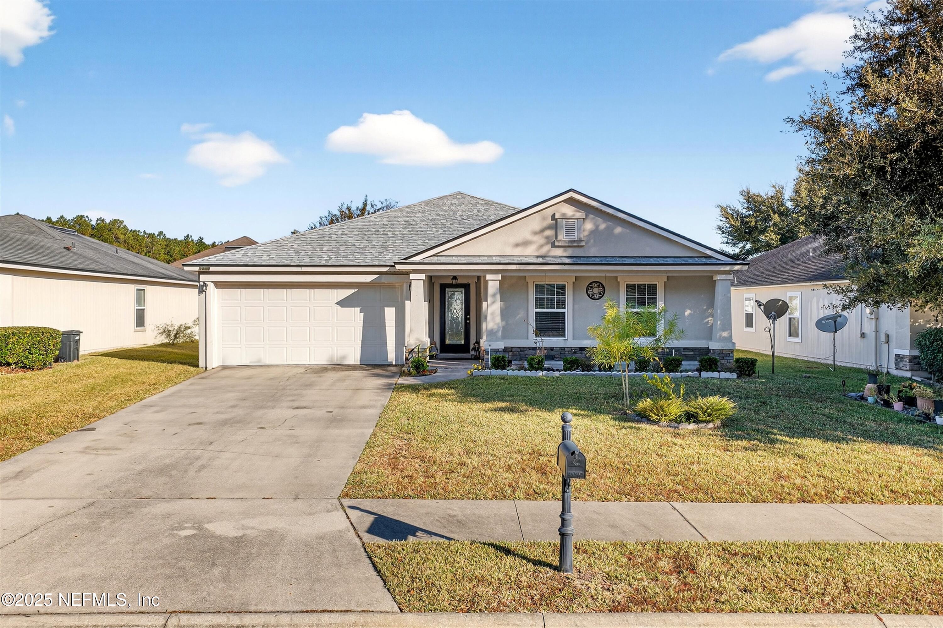 4045 Trail Ridge Road Middleburg, FL 32068 - Photo 2 of 45 a front view of a house with a yard