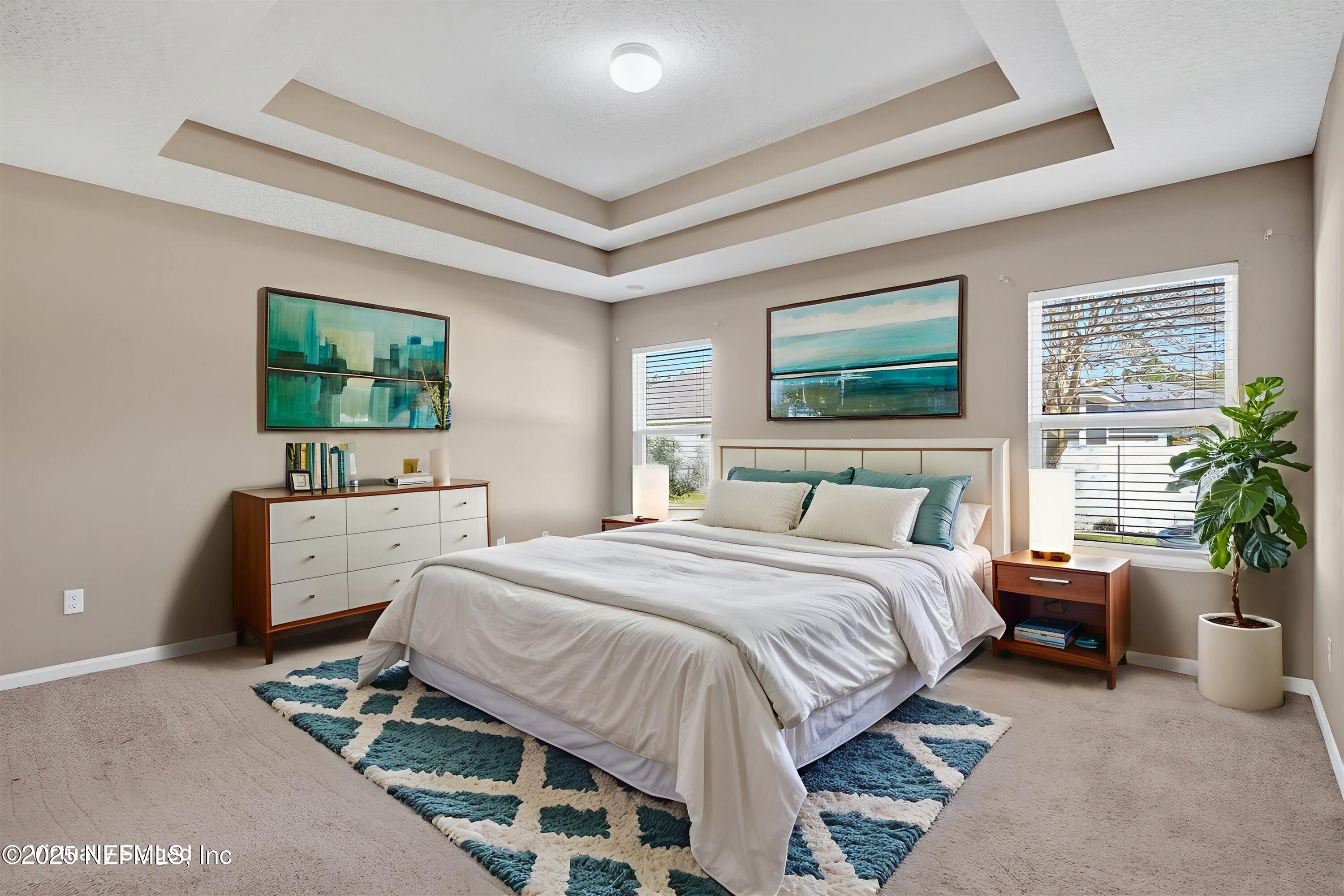 4045 Trail Ridge Road Middleburg, FL 32068 - Photo 21 of 45 a spacious bedroom with a bed and a couch