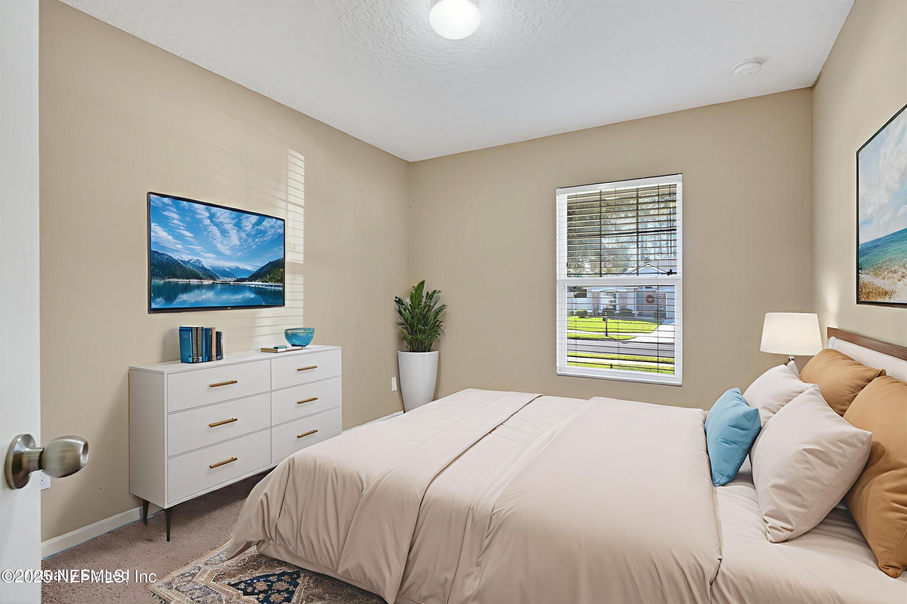 4045 Trail Ridge Road Middleburg, FL 32068 - Photo 30 of 45 a bedroom with a bed and a window