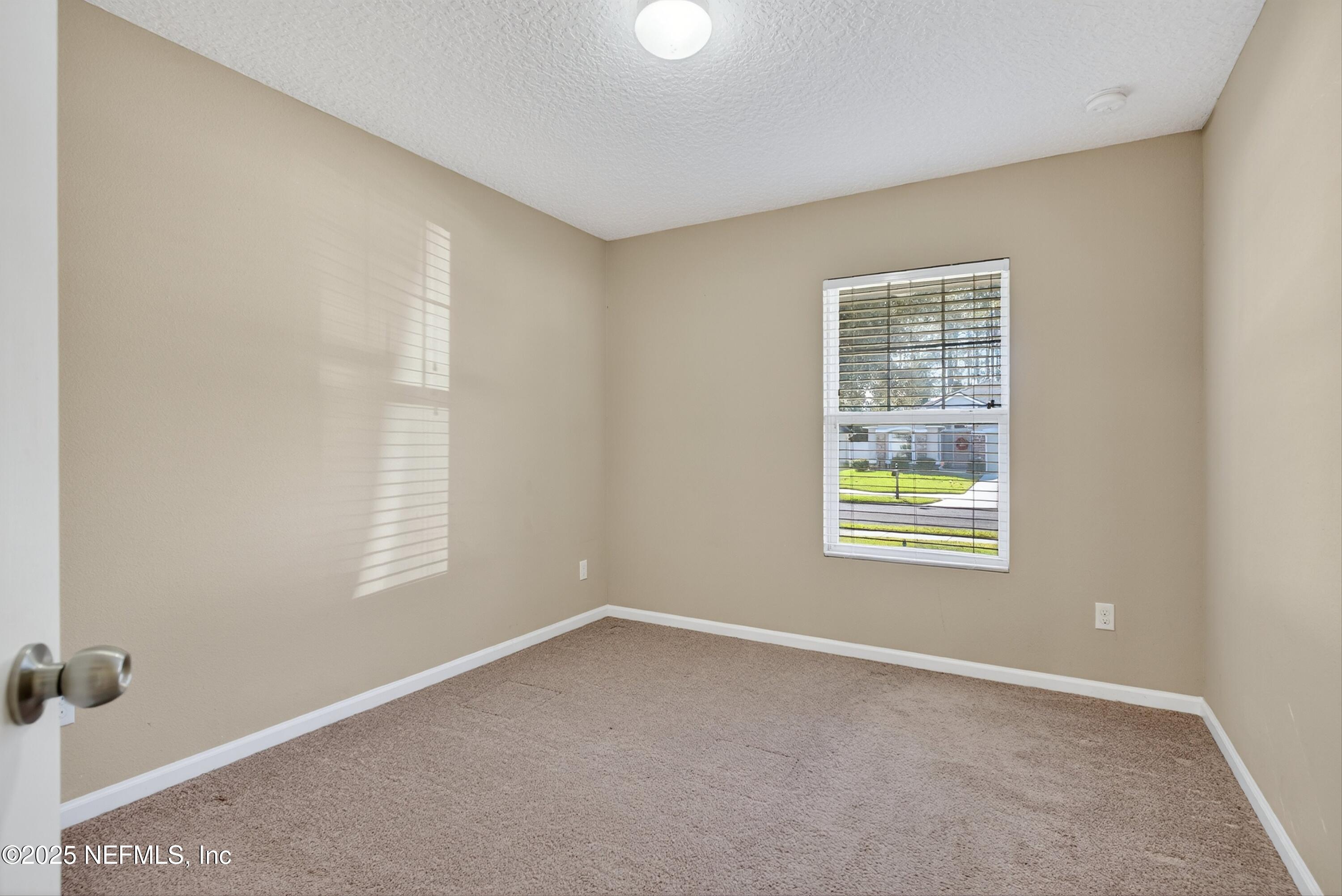 4045 Trail Ridge Road Middleburg, FL 32068 - Photo 31 of 45 an empty room with windows