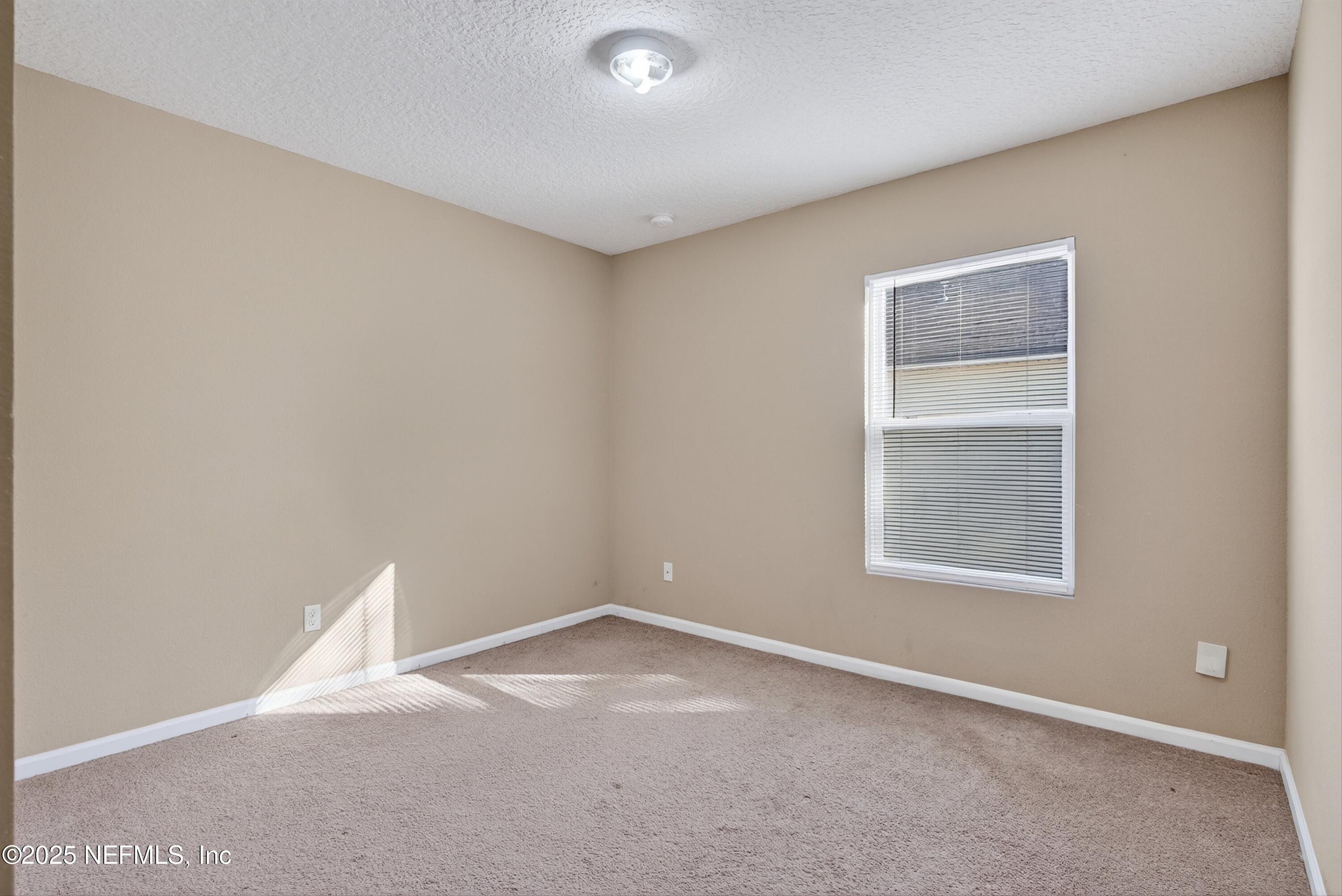 4045 Trail Ridge Road Middleburg, FL 32068 - Photo 34 of 45 an empty room with a window