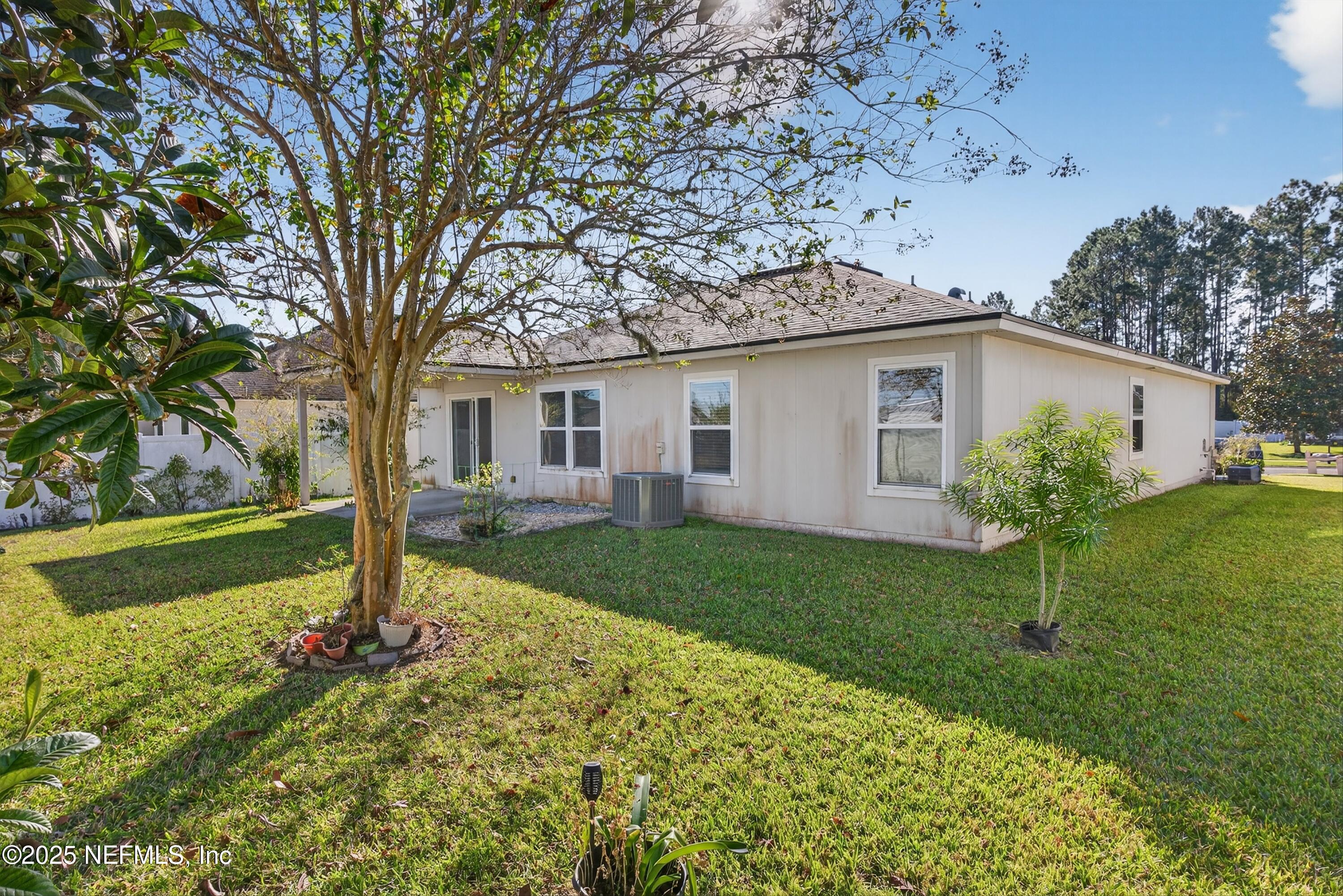 4045 Trail Ridge Road Middleburg, FL 32068 - Photo 37 of 45 a view of a house with backyard and garden