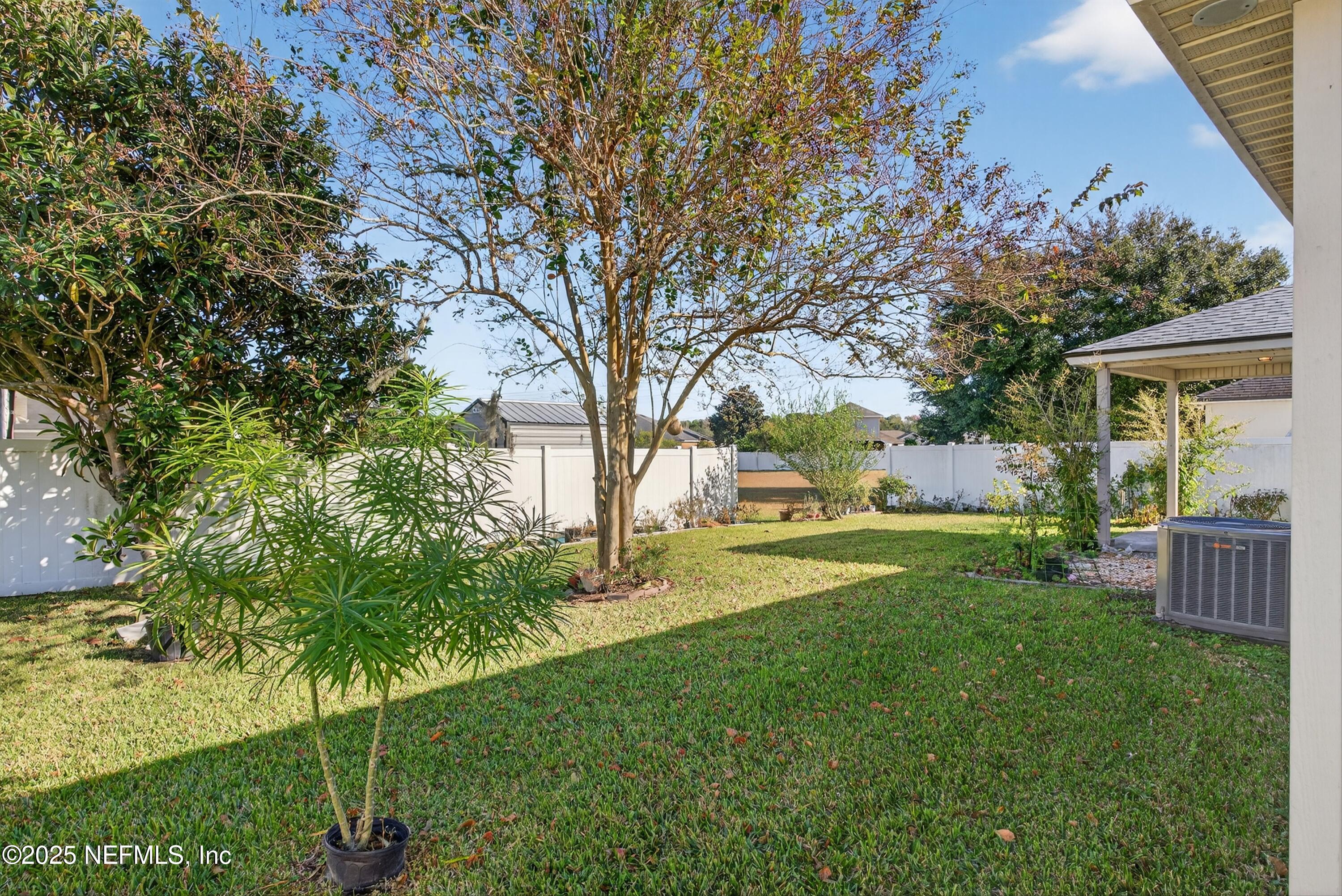 4045 Trail Ridge Road Middleburg, FL 32068 - Photo 38 of 45 a view of a backyard with a garden
