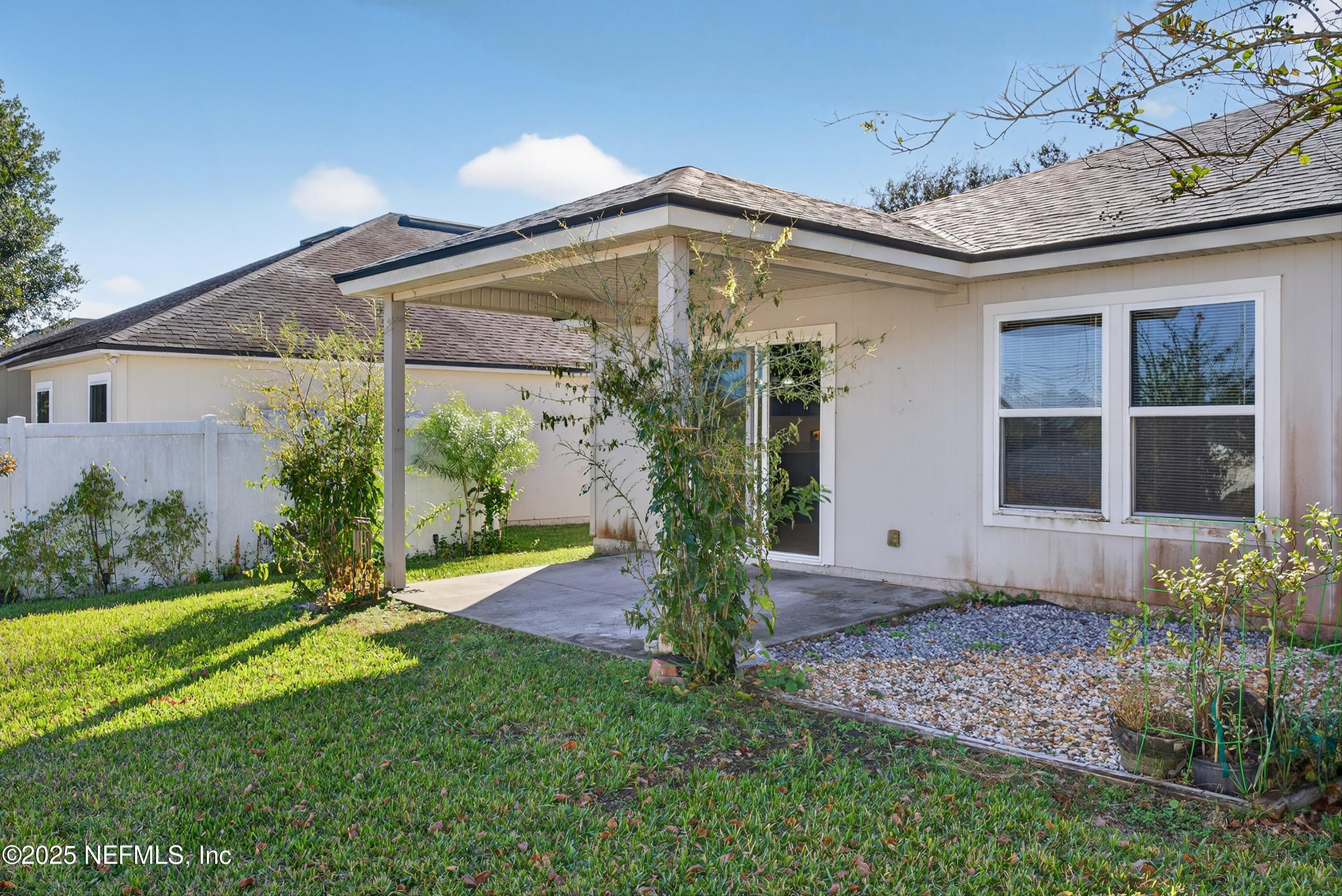 4045 Trail Ridge Road Middleburg, FL 32068 - Photo 39 of 45 a view of a house with backyard and garden
