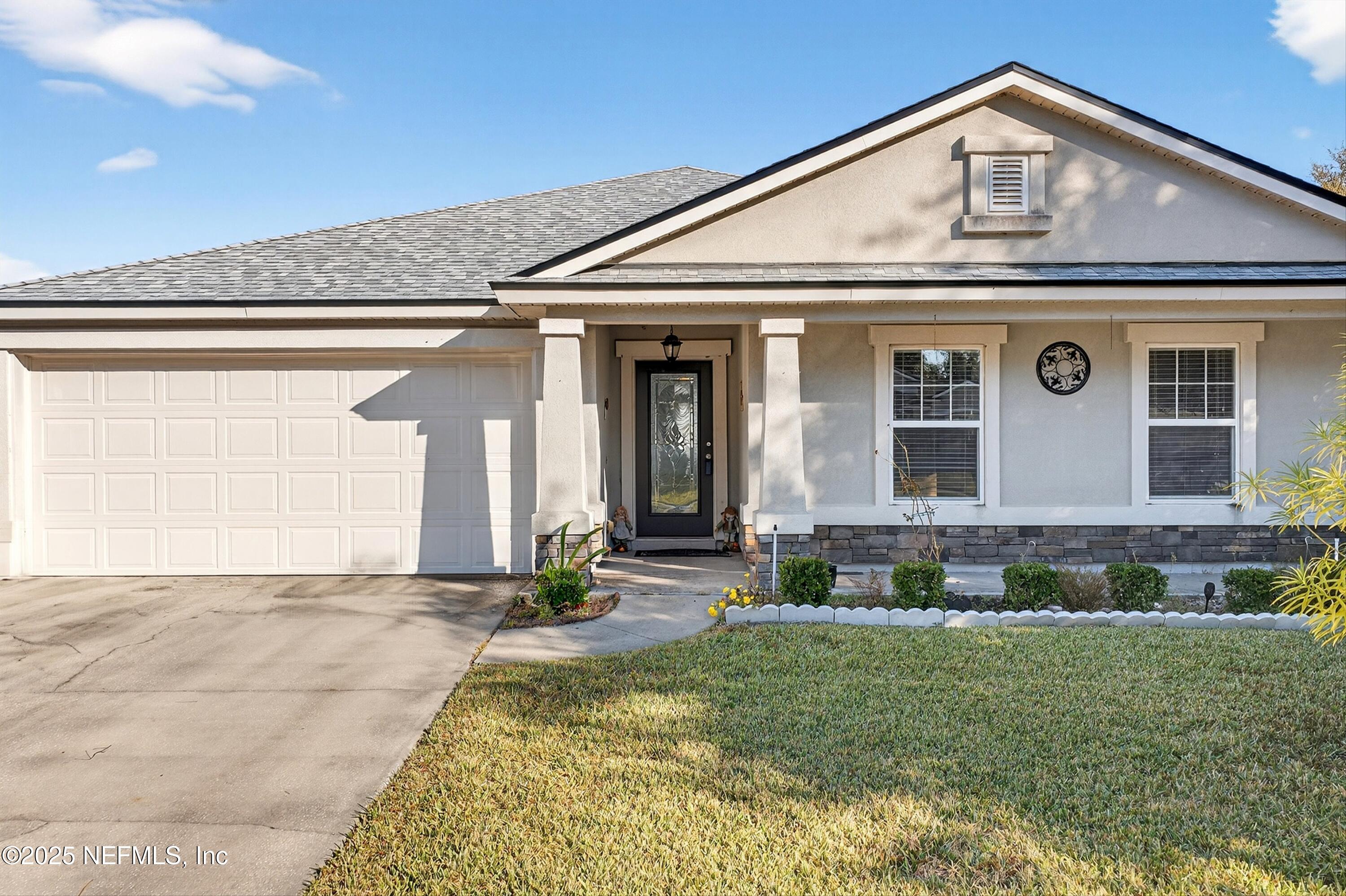 4045 Trail Ridge Road Middleburg, FL 32068 - Photo 5 of 45 a front view of a house with a yard
