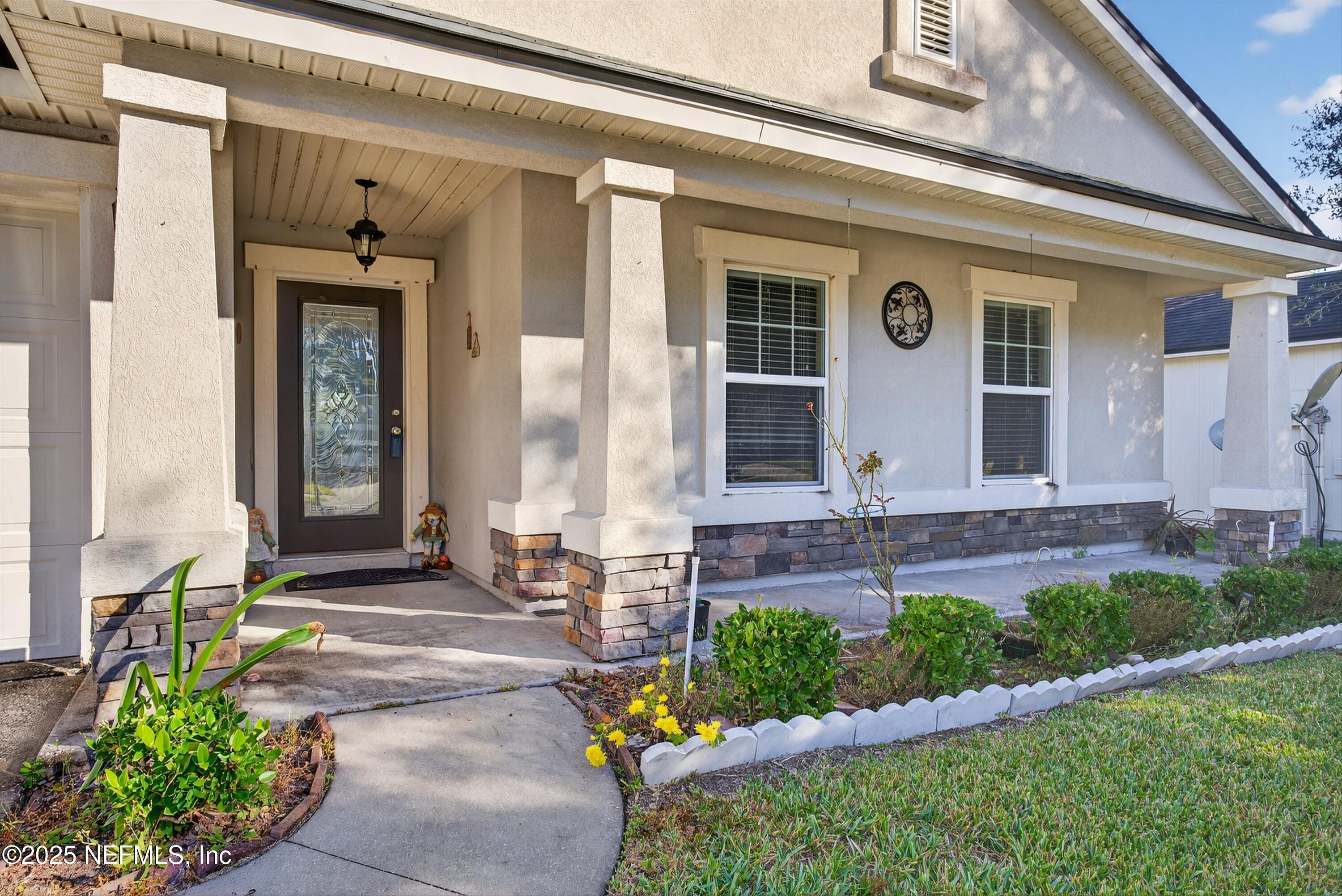4045 Trail Ridge Road Middleburg, FL 32068 - Photo 6 of 45 a front view of a house with garden