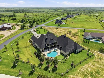 an aerial view of a house with a garden