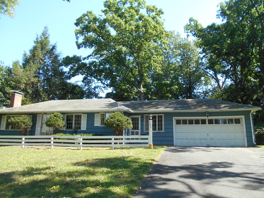 a front view of a house with swimming pool
