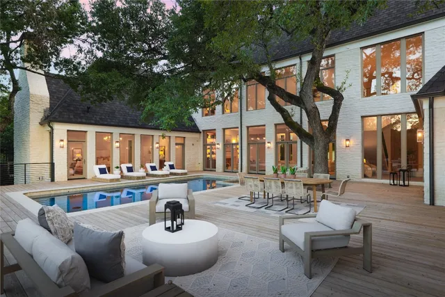 a view of swimming pool with outdoor seating