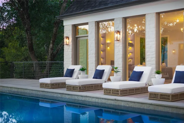 a view of swimming pool with outdoor seating and outdoor seating