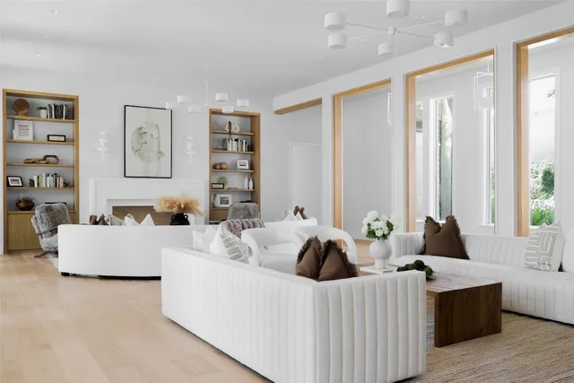 a living room with furniture and a potted plant