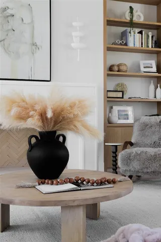 a living room with furniture and decor