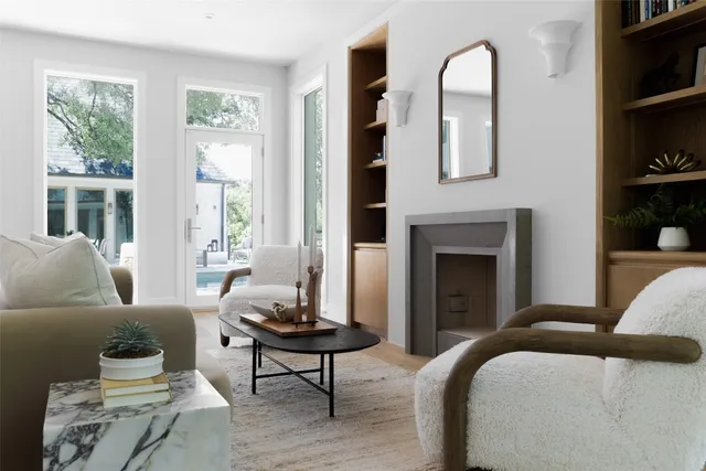a bathroom with a sink a mirror and a potted plant