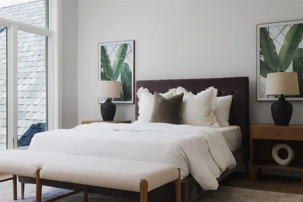 a bedroom with a bed and a couch