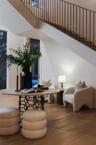 a living room with furniture flowerpot and a potted plant