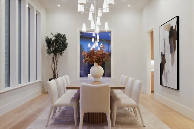 a dining room with furniture and chandelier kitchen view